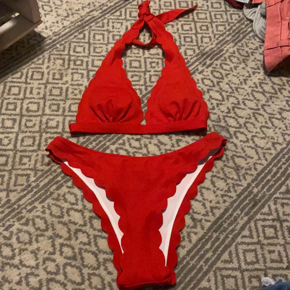 a red cute styling bathing suit .